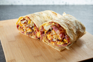 A view of a pastrami breakfast burrito.