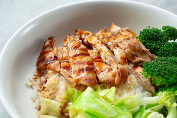 A closeup view of a chicken teriyaki bowl.