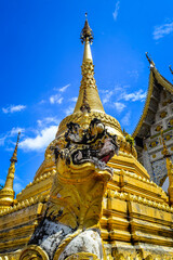 Fototapeta premium Chapel and Gold Pagoda, Lanna Architecture, Symbols of Buddhism, South East Asia at Ko Klang temple, Muang Chiang Mai, Chiang Mai, Northern Thailand