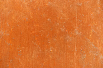 orange rust stains on weathered steel plate or top view yellow iron table and old brown metal wall...