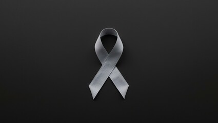 gray ribbon design on a plain black background. For awareness