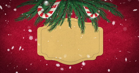 Image of sign with copy space, christmas fir tree branches on red background