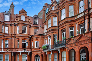 London, England, ornate old red brick apartment buildings near Sloane Square