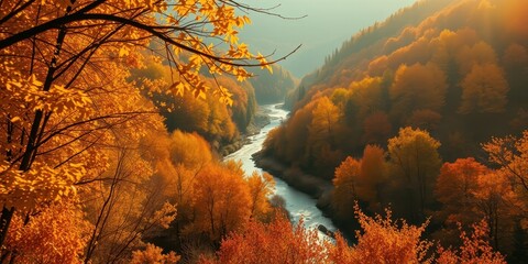 A winding river snakes through a valley draped in the vibrant hues of autumn, with golden leaves painting the landscape and sunlight filtering through the canopy.