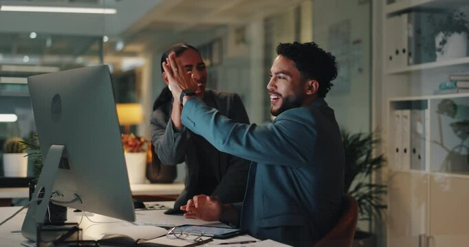Evening, high five or business people in office, computer or achievement with kpi target. Employees, man or woman with pc, hand gesture or joy with success, excited or email notification for approval