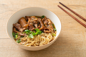 Stewed pork leg noodles in brown soup