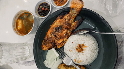 Grilled fish with rice and soup