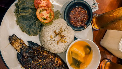 Indonesian grilled fish with rice and soup