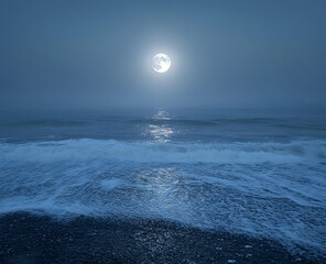 A moonlit sea veiled in mist offers a serene and mysterious atmosphere