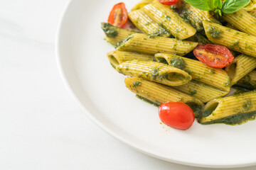 penne pasta with pesto sauce and tomatoes