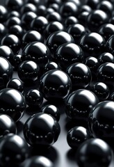 Closeup of numerous glossy black spheres, varying in size, densely packed together. Creates a dark, abstract, 3D rendered texture.