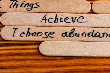 Positive thoughts for increasing selfesteem on wooden posts on wooden background