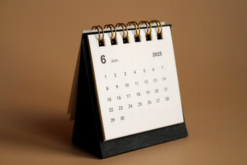 Monthly calendar template for the new year 2025 desk calendar,isolated on Beige background.