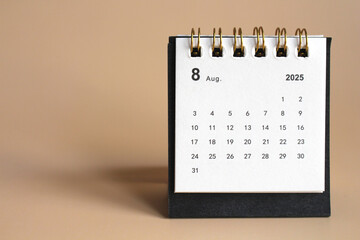 Monthly calendar template for the new year 2025 desk calendar,isolated on Beige background.