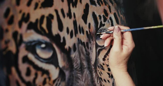 Woman Painting Picture of Leopard
