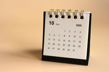 Monthly calendar template for the new year 2025 desk calendar,isolated on Beige background.