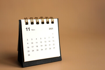 Monthly calendar template for the new year 2025 desk calendar,isolated on Beige background.