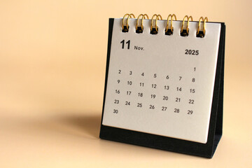 Monthly calendar template for the new year 2025 desk calendar,isolated on Beige background.