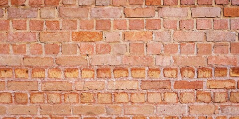 Obraz premium Close-Up of Textured Red Brick Wall with Natural Imperfections