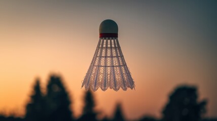 Silhouette of person wearing traditional hat at sunset with warm sky tones
