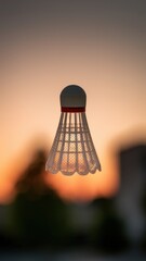 Woven dish with pointed top hanging against warm orange sunset tones