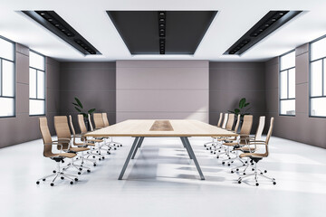 Modern conference room interior with large table, chairs, and bright windows in a contemporary...