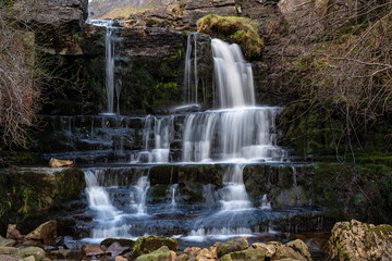 Obraz premium Waterfall in rugged terrain in upper Swaledale