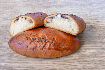 Freshly baked bun with savory drippings and caraway seeds