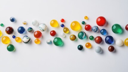 A captivating visual of diverse, colorful marbles scattered across a clean, reflective surface