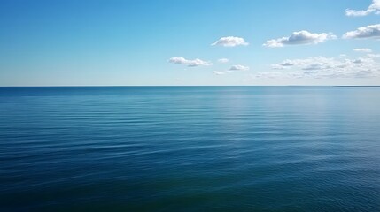 Obraz premium Baltic Sea aerial view showcasing vast expanse of water and distant coastline, symbolizing natural beauty and serene landscapes.