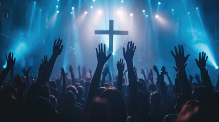 Crowd raising hands during worship service