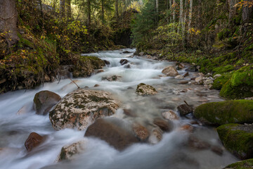 The stream at val di funes in autumn season Dolomites Italy