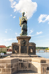 Obraz premium Sculpture of St John of Nepomuk by Ian Brokoff on the Charles Bridge in Prague in the Czech Republic