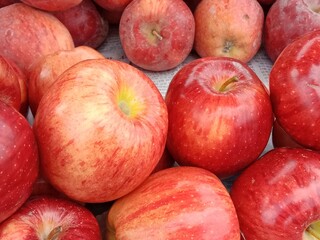 Apple fruit pile displayed in order on vendor's.Malus pumila fruit pile show for sale in the market 