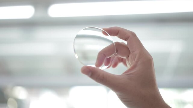 hand with lenses, glasses lenses 