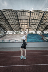 Portrait of a young beautiful athletic girl in the summer outdoors.