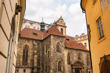 Picturesque narrow streets with medieval buildings in the monumental city of Prague.