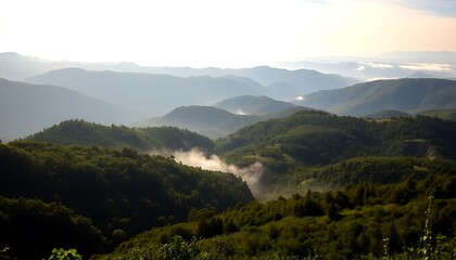 Fototapeta premium Misty Mountain Ranges Verdant Hills Foggy Valleys Scenic View.Layers of mountains create a dramatic peaceful landscape.