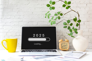 Loading year 2025 for start new business and new life. Equipment working in office with coffee...