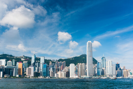 Hong Kong - July 16, 2019: Panoramic cityscape view from Victoria Harbour in Hong Kong. International Finance Center(IFC) 
