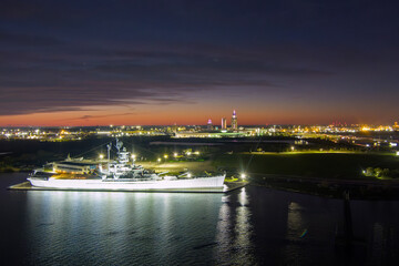 Downtown Mobile and the battleship at sunset