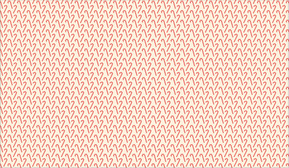 Obraz premium christmas pattern of red candy canes on a beige background