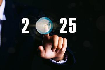 Businessman touching target icon on virtual screen. Startup business 2025. merry Christmas and happy new year concept.