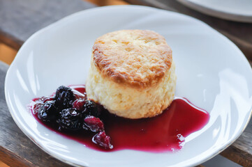scone with berry sauce or berry dressing