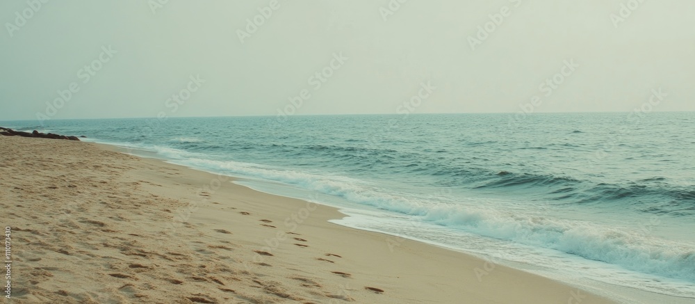 Aufkleber tranquil beach sunrise over gentle waves with soft grainy texture creating a serene coastal atmosphe
