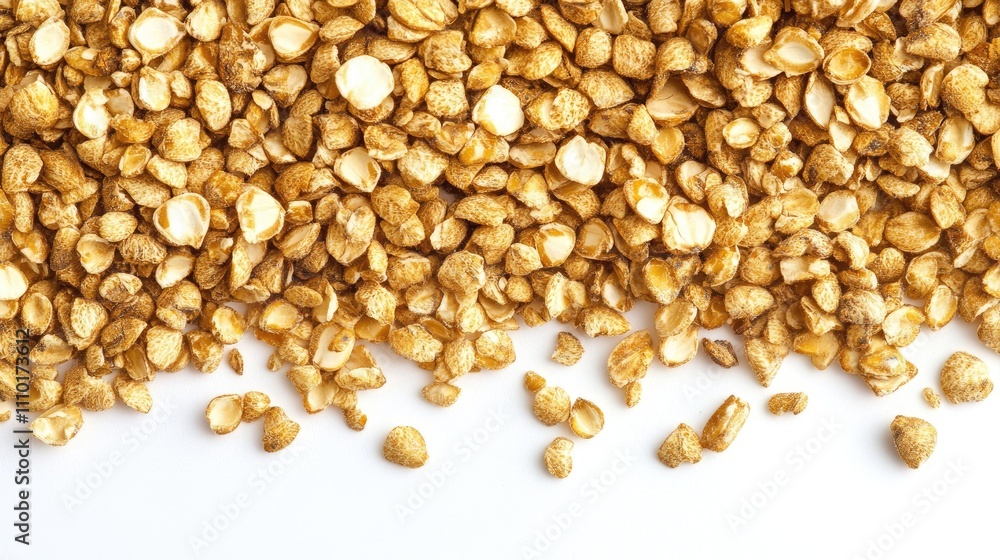 Aufkleber Buckwheat groats piled on a plain white background highlighting their texture and color in a close-up view for culinary and health themes