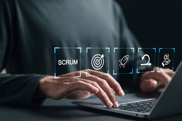 SCRUM, agile development methodology concept. Person using laptop with SCRUM icons on virtual screen