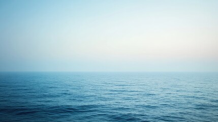 Fototapeta premium Calm and Serene Ocean View Under Clear Blue Sky at Dusk