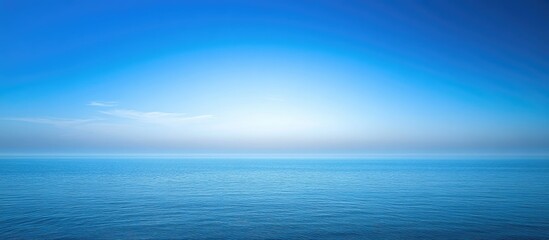 Fototapeta premium tranquil blue ocean horizon with clear sky serene coastal view during peak season perfect for relaxation and travel themed visuals