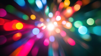 An abstract composition of multi-colored light spots converging into a unified, glowing circle on a dark background